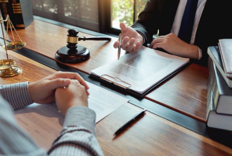 Image is of a family lawyer consulting with a client