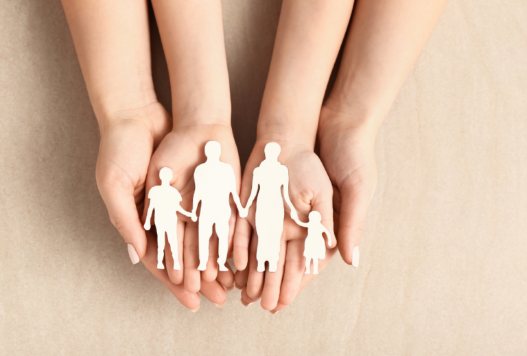 Image is of a child's hands laying in the mother's hands, concept of adoption process in Tennessee