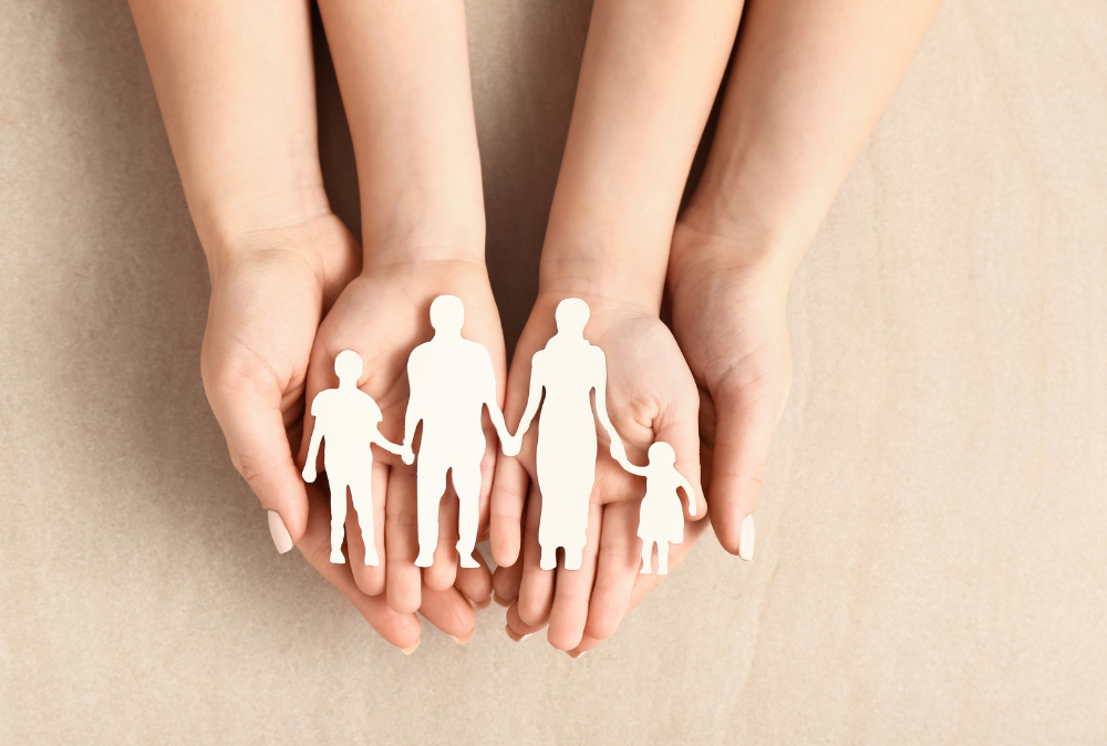 Image is of a child's hands laying in the mother's hands, concept of adoption process in Tennessee