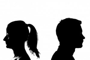 Image is of the silhouette of a man and woman with their backs to one another, concept of legally separated in the same house.