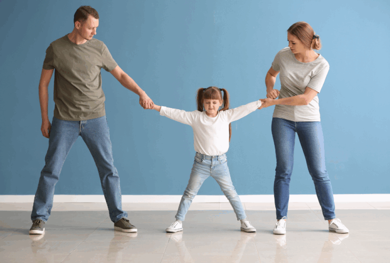 Image is of a young girl standing between her parents while they are pulling her in different directions, concept of child choosing which parent to live with in Tennessee