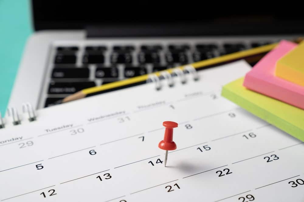Calendar with red pin showing co parenting schedule planning for shared custody schedules