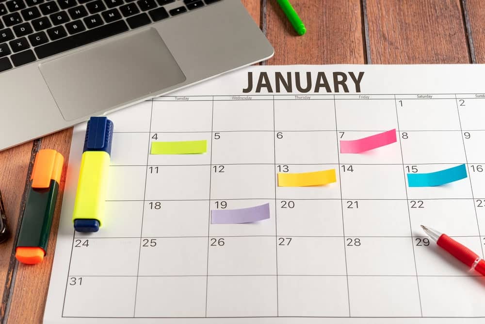 Image shows a January calendar with colorful sticky notes and markers, representing timeline planning for the divorce process.