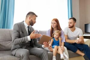 Image is of a family speaking with a lawyer at home, illustrating guidance and decision making for a parenting plan in Franklin.