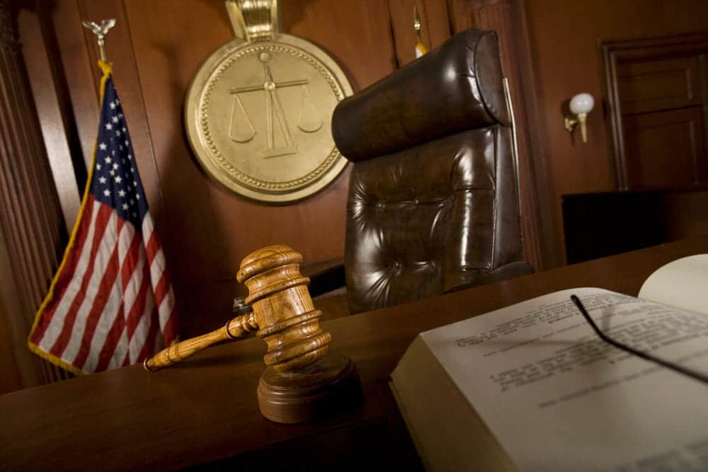 Image is of a courtroom with a judge’s bench and gavel, concept of a Franklin family law attorney handling court proceedings and legal disputes.